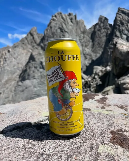 A can of La Chouffe on a granite summit in the Tetons